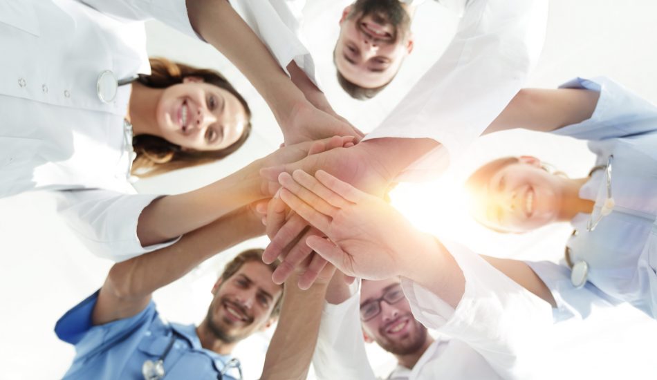 Bottom,View.a,Team,Of,Doctors,At,The,Medical,Center,Clasped