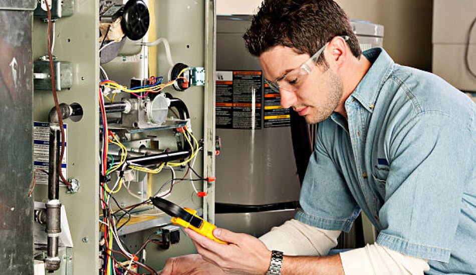 Service technician testing a furnace