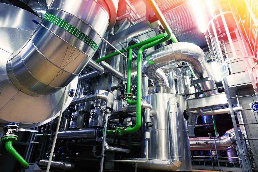 Equipment, cables and piping as found inside of a modern industrial power plant